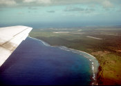 Wilcommen, No. 0172 Aerial View of the Southwest Point of Saipan Over the Wing of a Plane